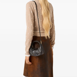 Brown bags worn by a person, showing the bags fit