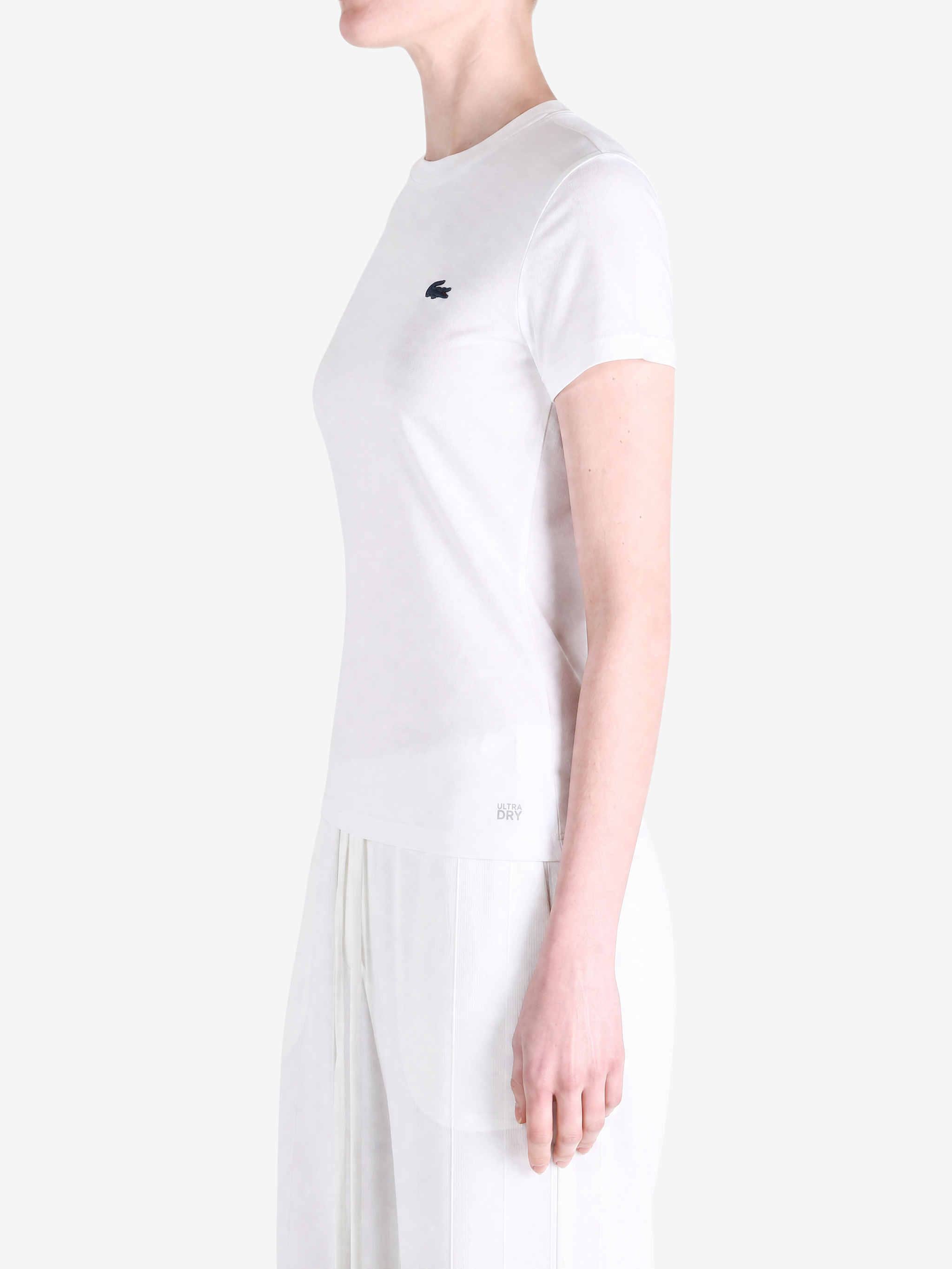 White t-shirt worn by a person, showing the t-shirt fit
