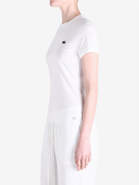 White t-shirt worn by a person, showing the t-shirt fit