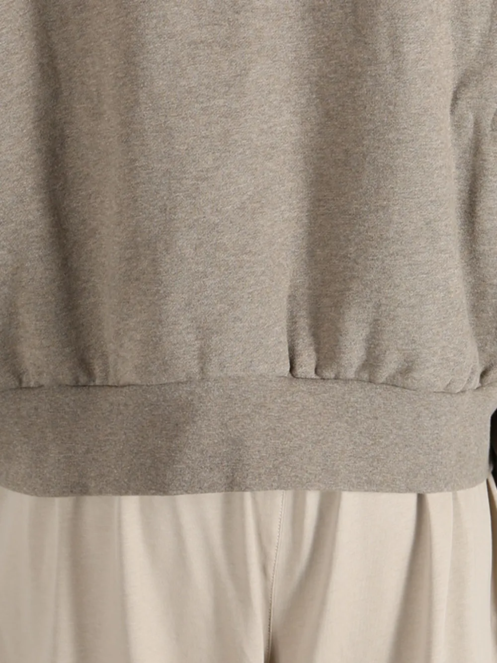 Close up of the brown top, showing texture of the cotton fabric