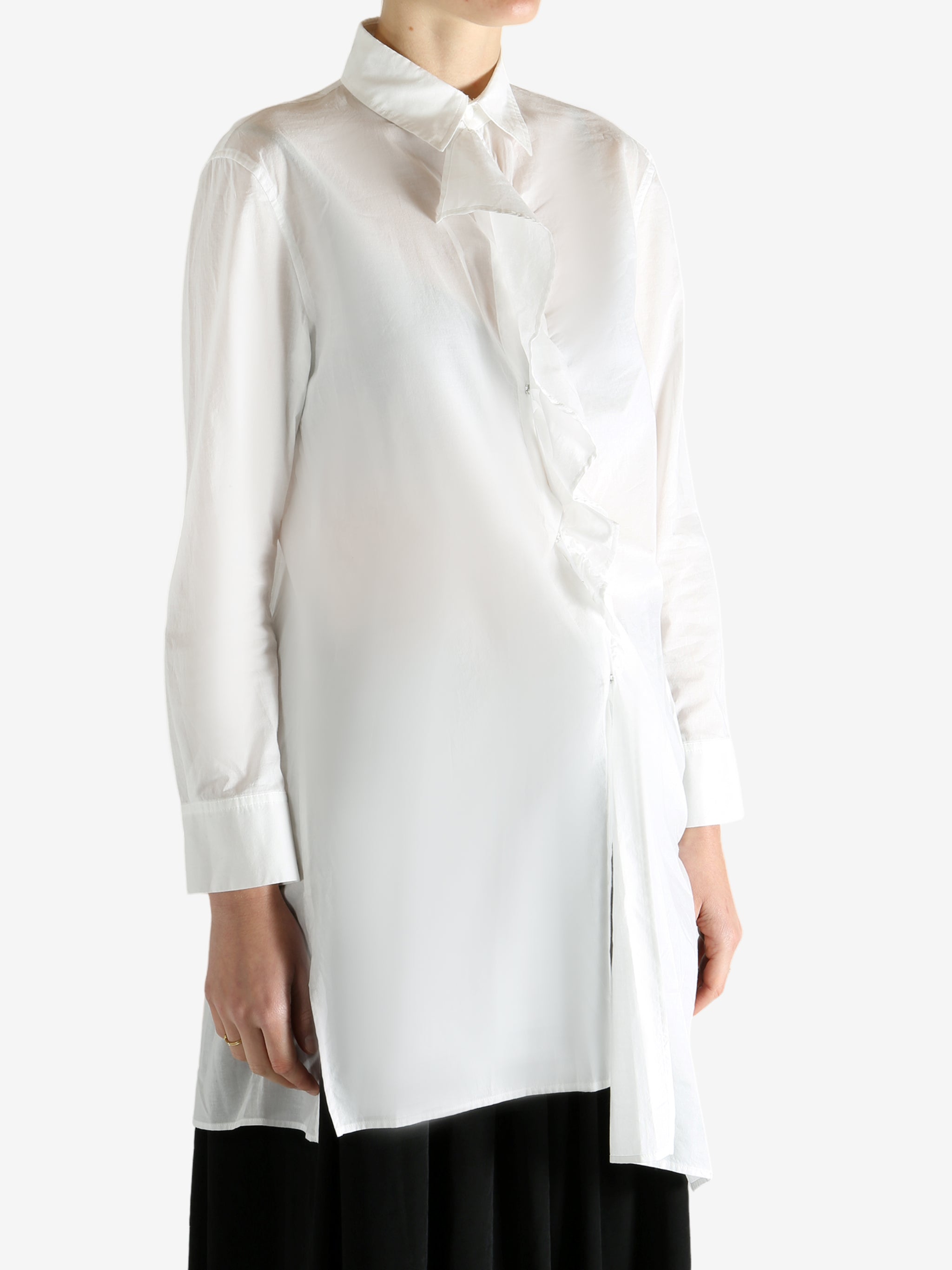 White shirts worn by a person, showing the shirts fit