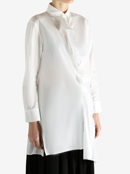 White shirts worn by a person, showing the shirts fit