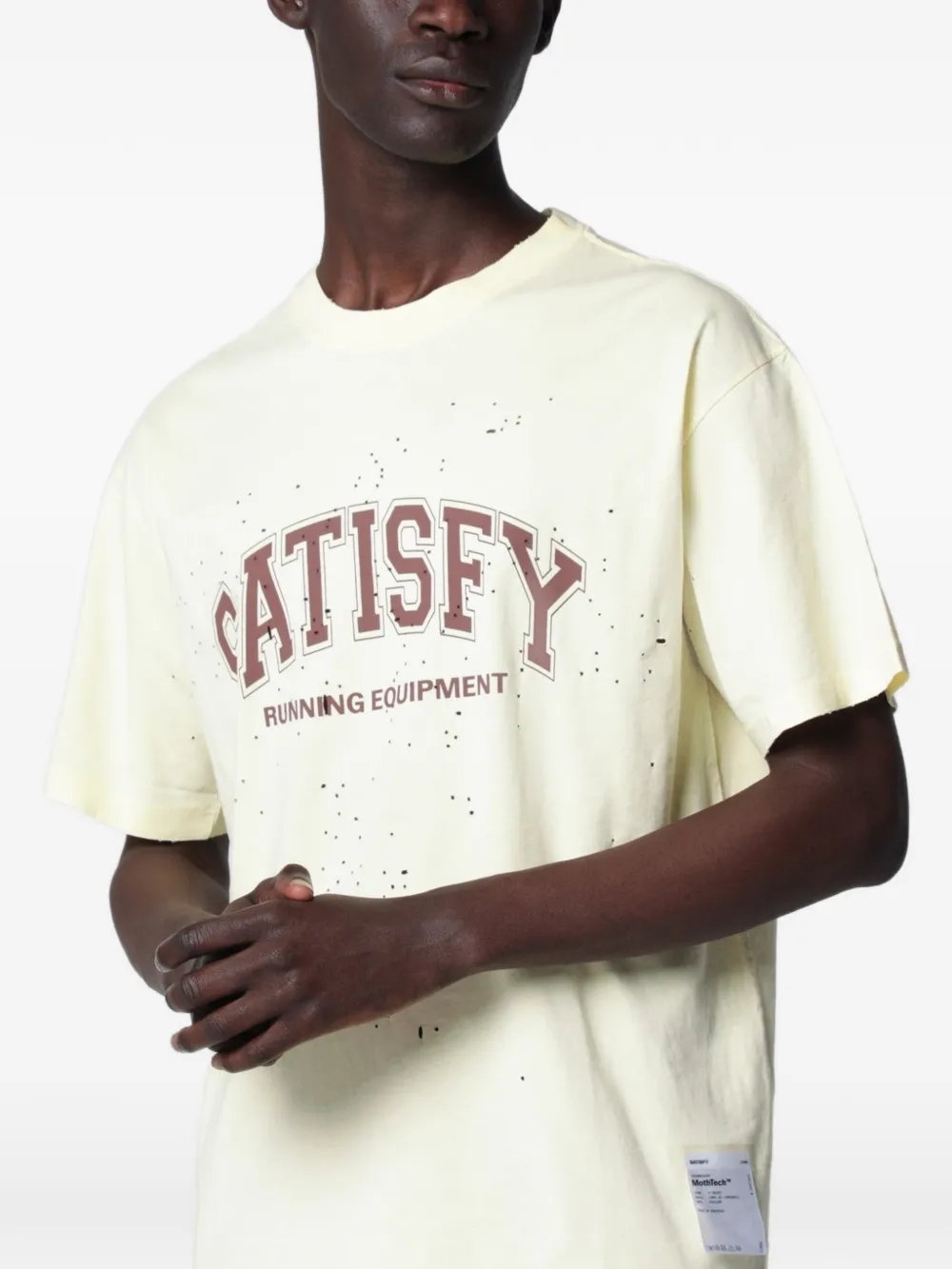 Yellow t-shirt worn by a person, showing the t-shirt fit