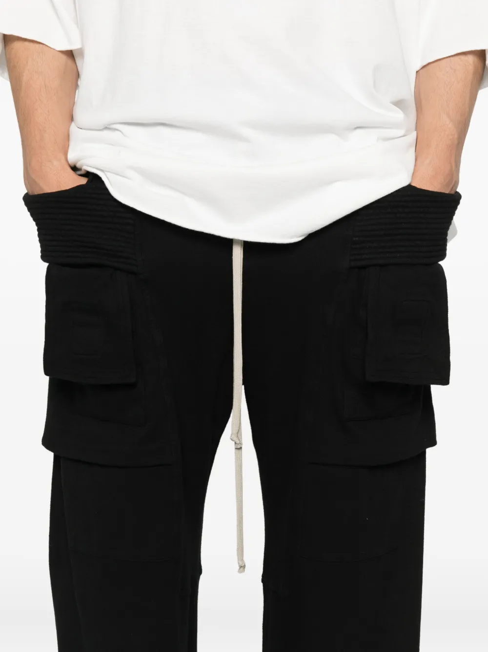Close up of black pants, showing texture of the cotton fabric