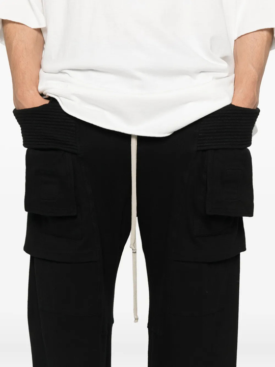Close up of black pants, showing texture of the cotton fabric