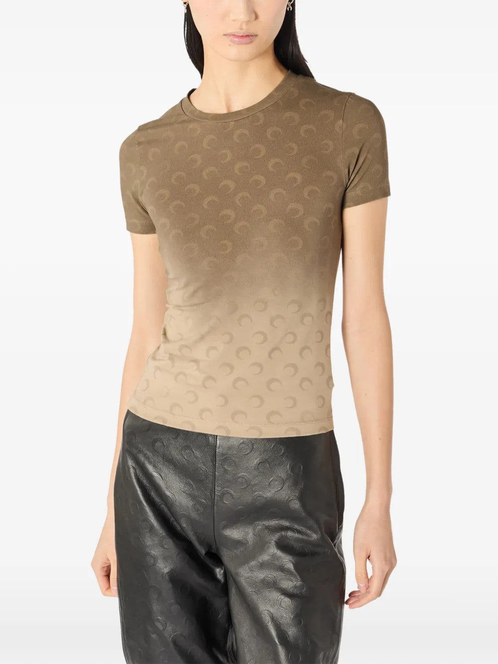 Brown t-shirt worn by a person, showing the t-shirt fit
