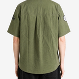 Green shirt, full body view