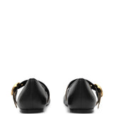 Black flats, back view