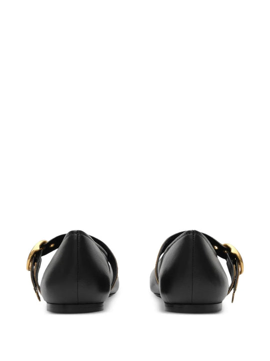 Black flats, back view