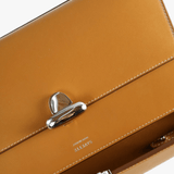 Close up of brown bag, showing texture of the calfskin fabric