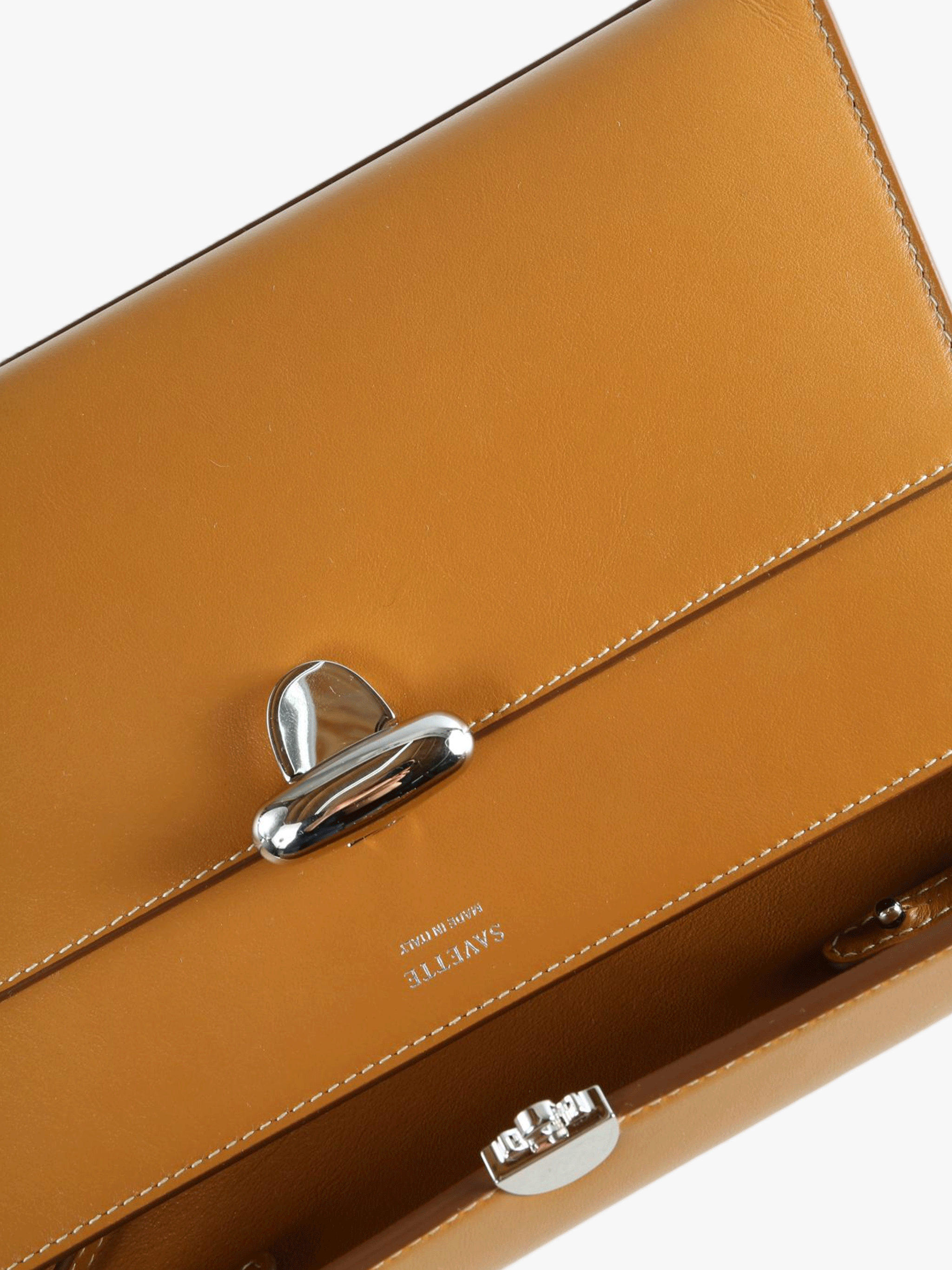 Close up of brown bag, showing texture of the calfskin fabric