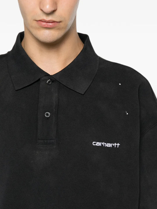 Black shirt worn by a person, showing the shirt fit