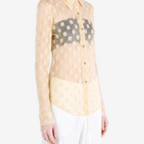 Tan shirt worn by a person, showing the shirt fit