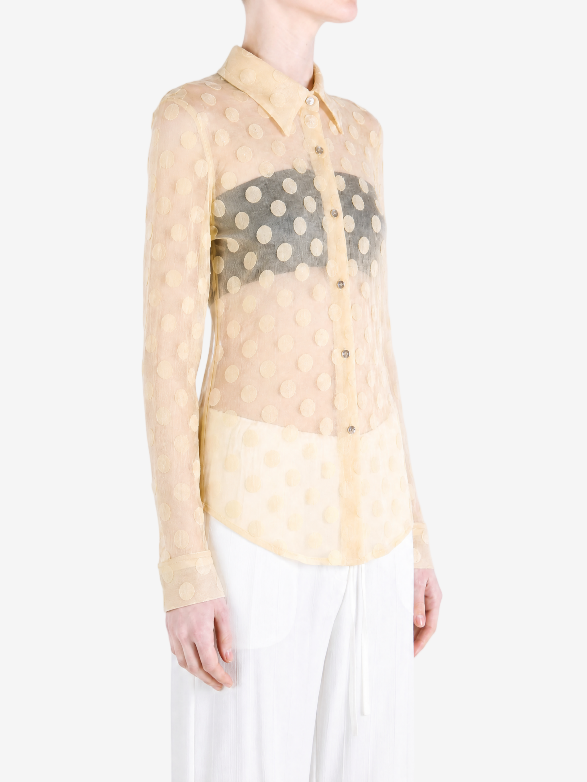 Tan shirt worn by a person, showing the shirt fit