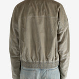 Tan jacket worn by a person, showing the jacket’s fit