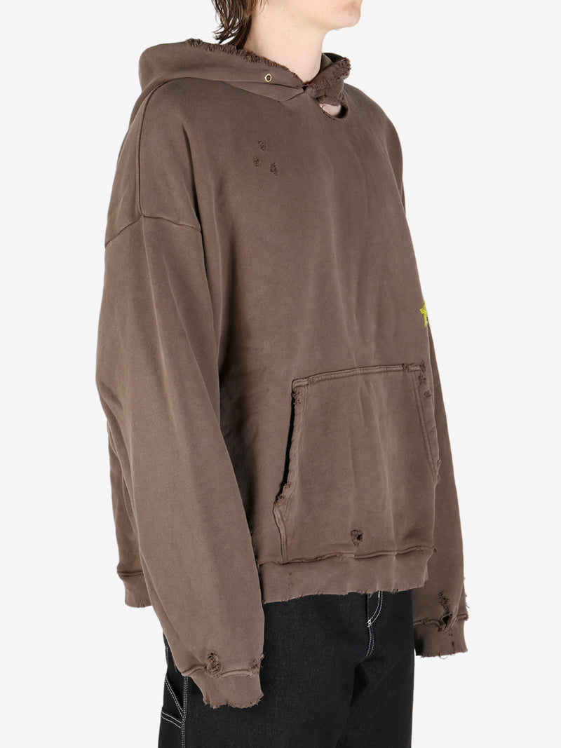 Brown sweatshirt worn by a person, showing the sweatshirt fit