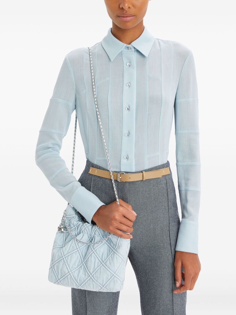 Blue bag carried by a person, showing the bag’s fit