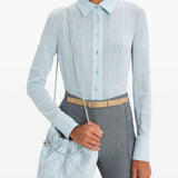 Blue bag carried by a person, showing the bag’s fit