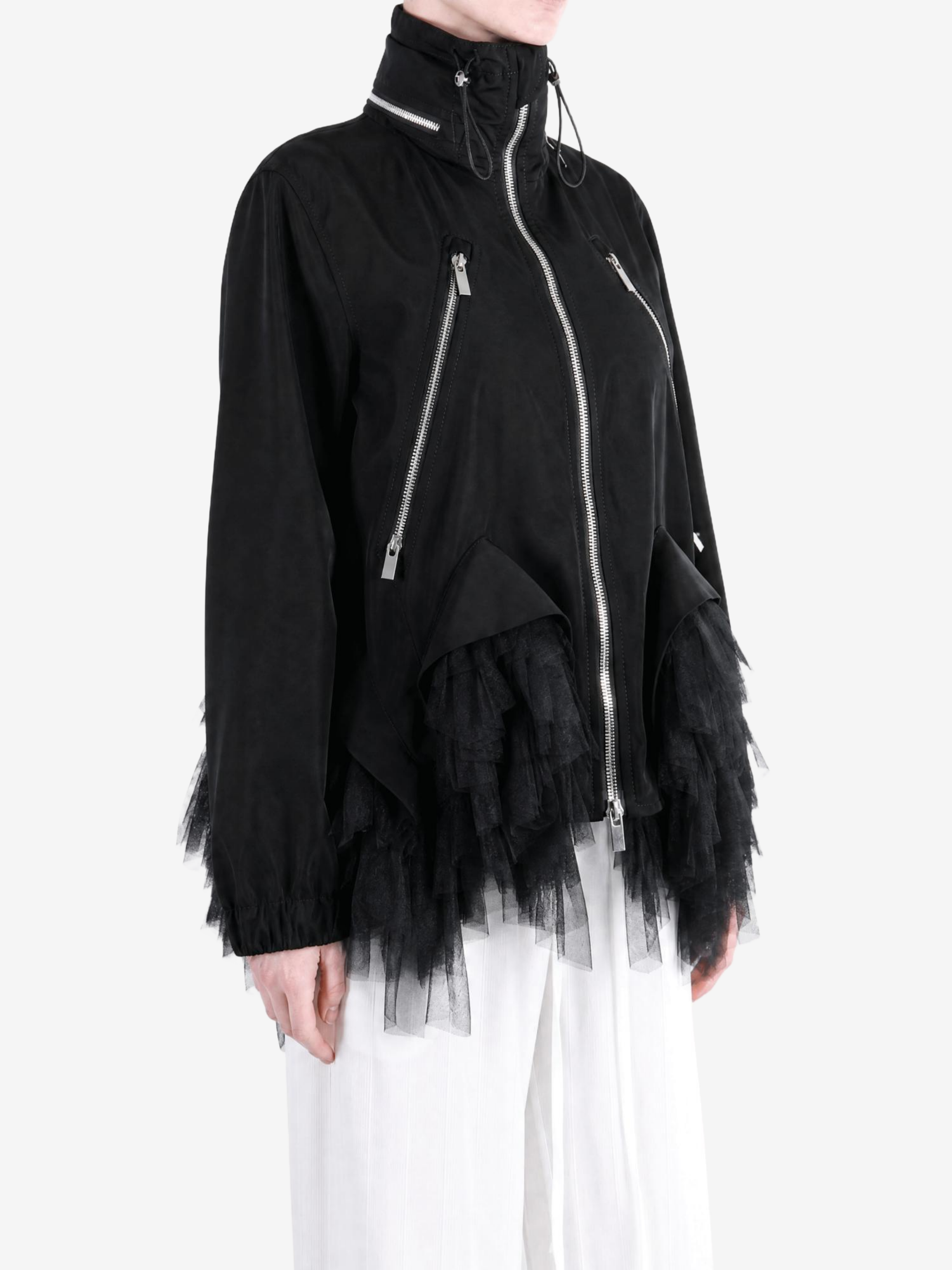 Black jacket worn by a person, showing the jacket fit