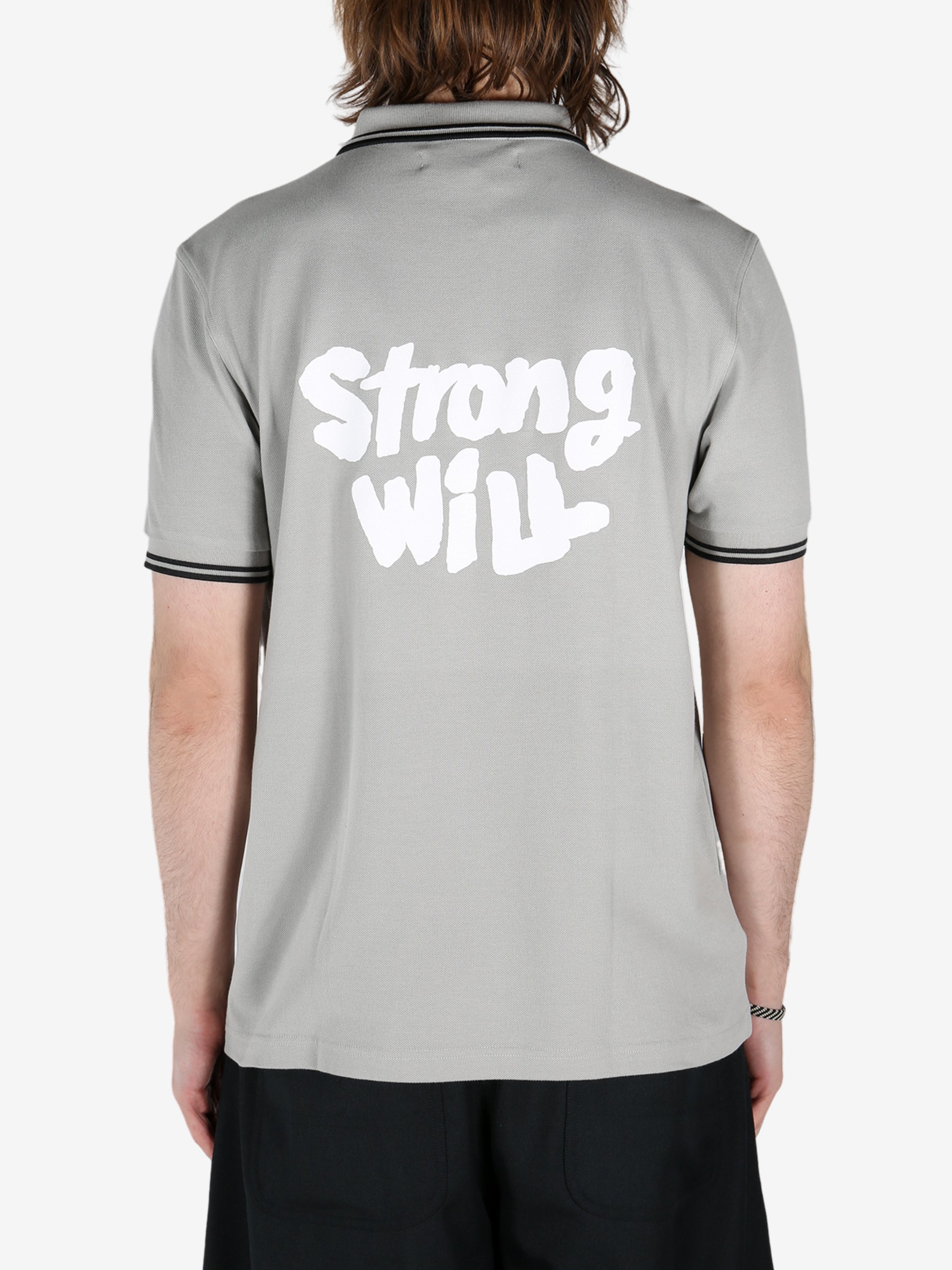 Grey shirt worn by a person, showing the shirt's fit 