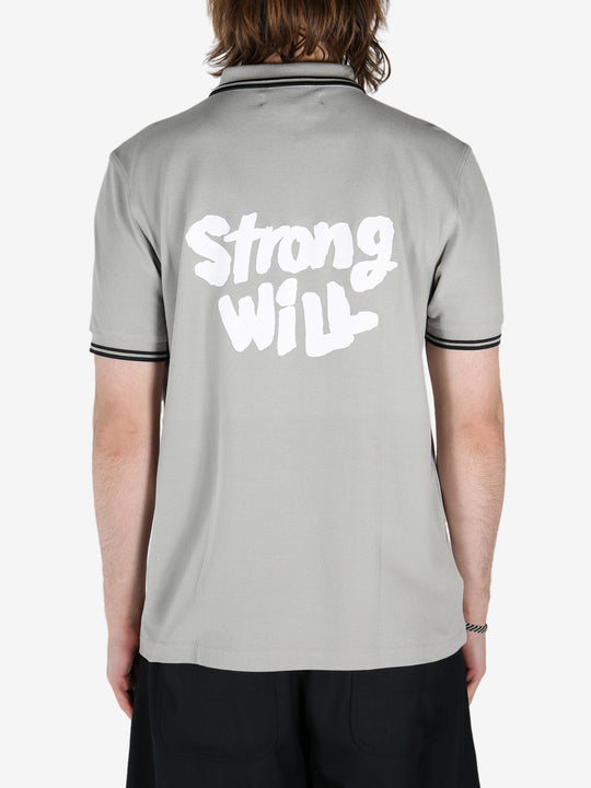 Grey shirt worn by a person, showing the shirt's fit 