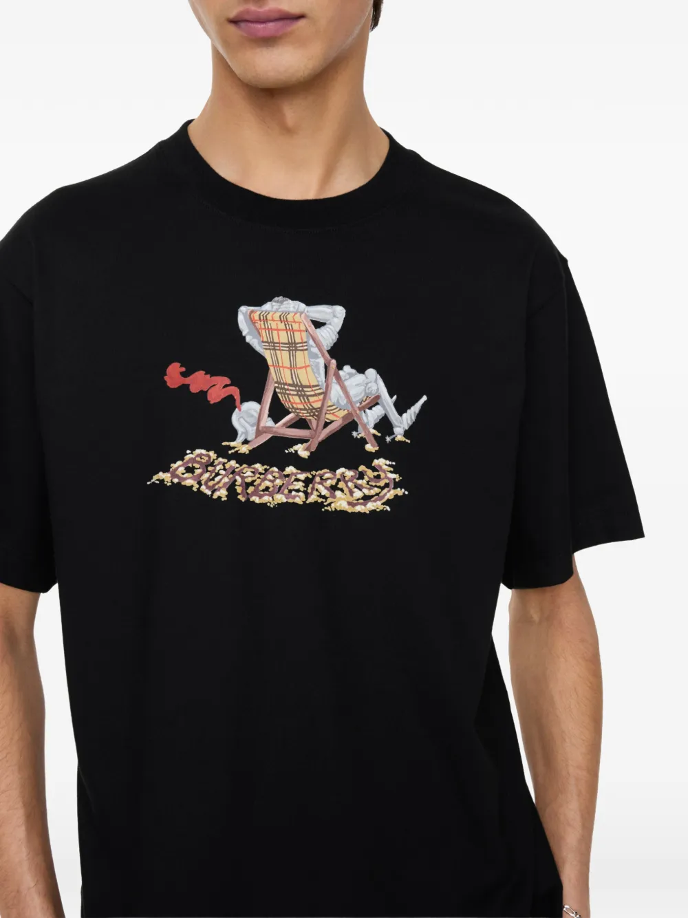 Close up of black t-shirt, showing texture of the Cotton fabric