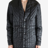 Black jacket worn by a person, showing the jacket's fit