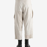 White pants worn by a person, showing the pants fit