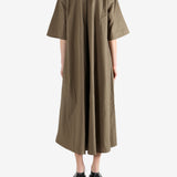 Brown dress worn by a person, showing the dress's fit