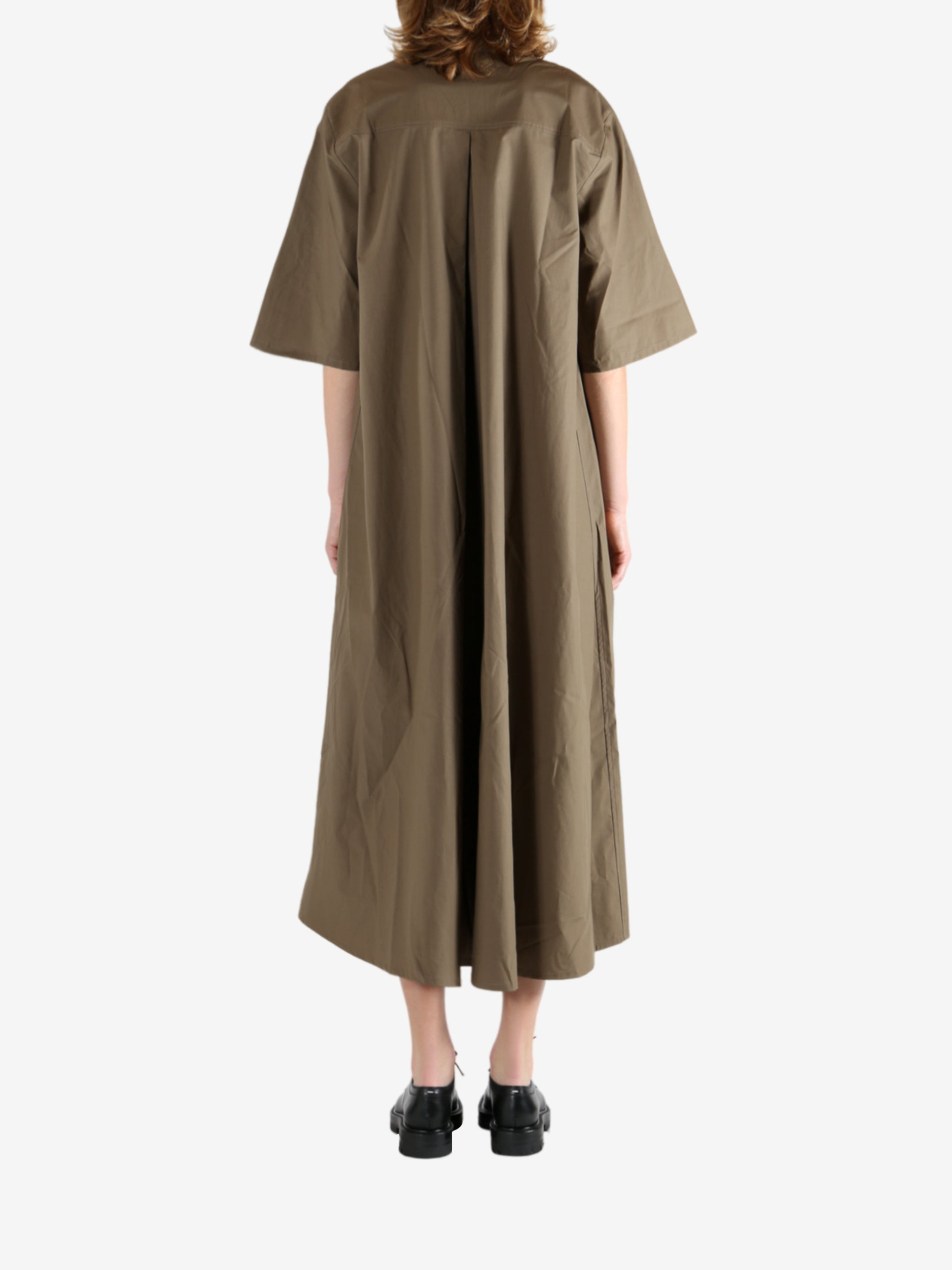 Brown dress worn by a person, showing the dress's fit