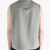 Grey top worn by a person, showing the top's fit