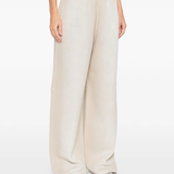 Tan pants worn by a person, showing the pants fit