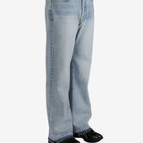 Blue jeans worn by a person, showing the jeans's fit