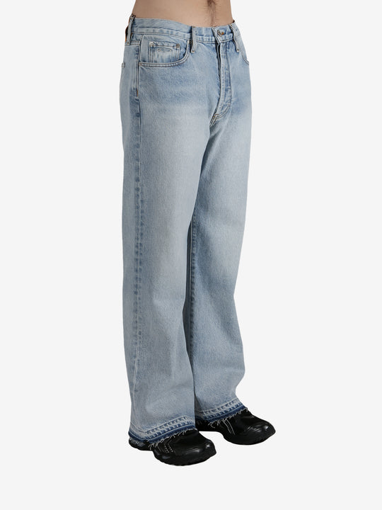 Blue jeans worn by a person, showing the jeans's fit