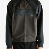 Brown jacket worn by a person, showing the jacket's fit