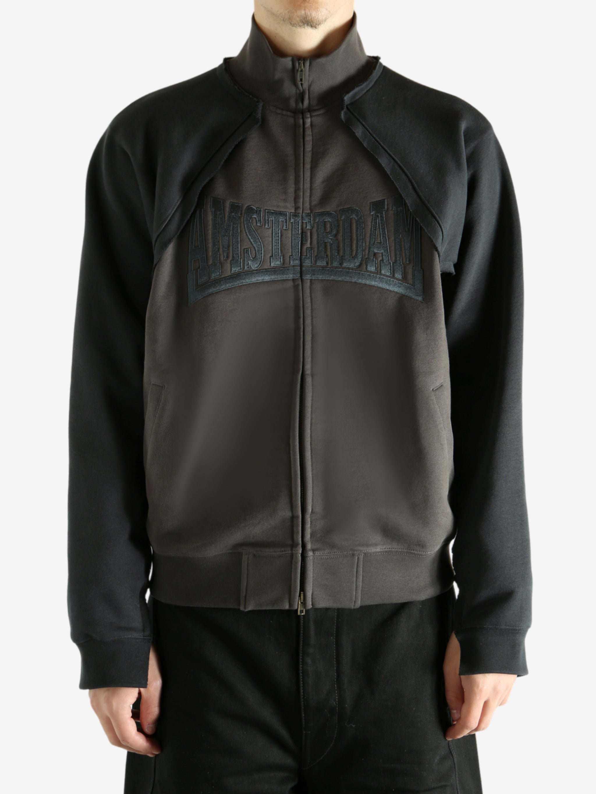 Brown jacket worn by a person, showing the jacket's fit