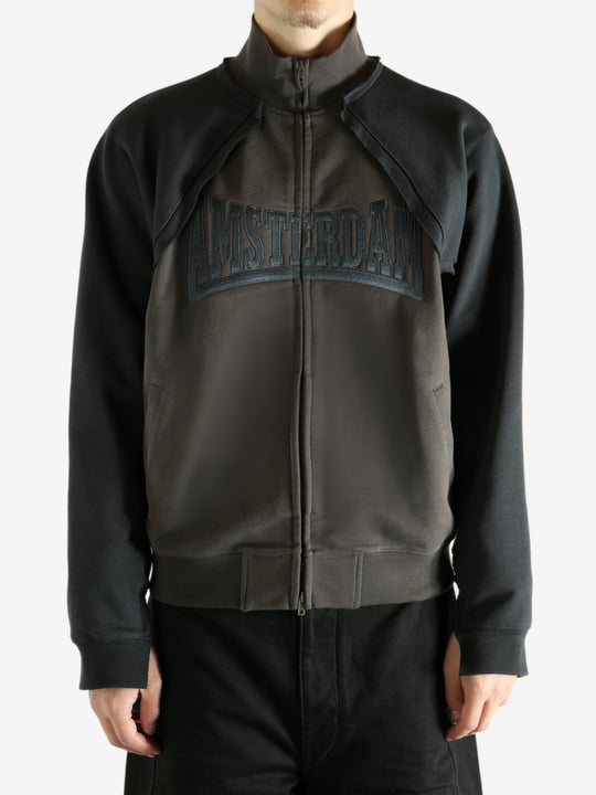 Brown jacket worn by a person, showing the jacket's fit