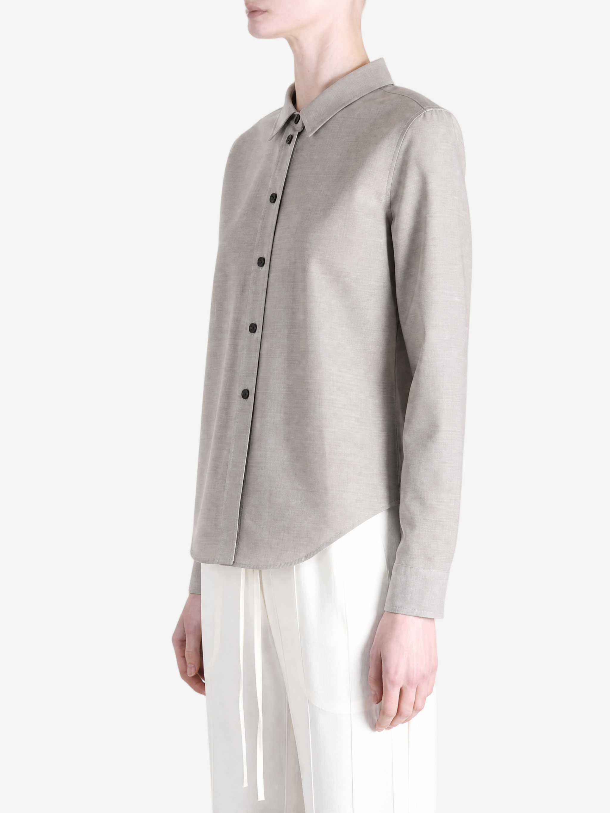 Grey shirt worn by a person, showing the shirt fit