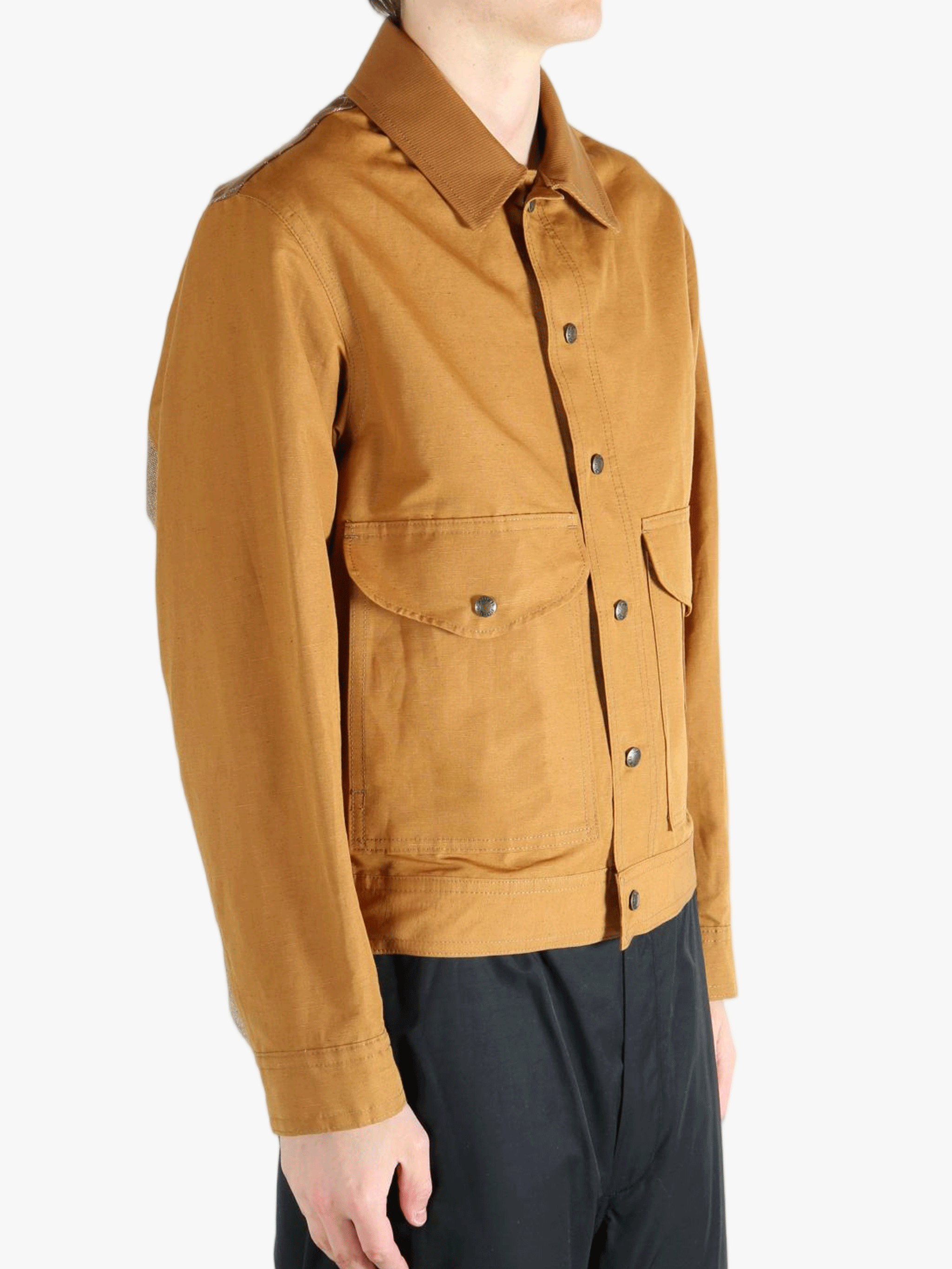 Brown jackets worn by a person, showing the jacket's fit 