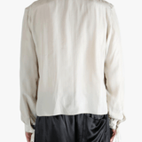 White shirt worn by a person, showing the shirt's fit