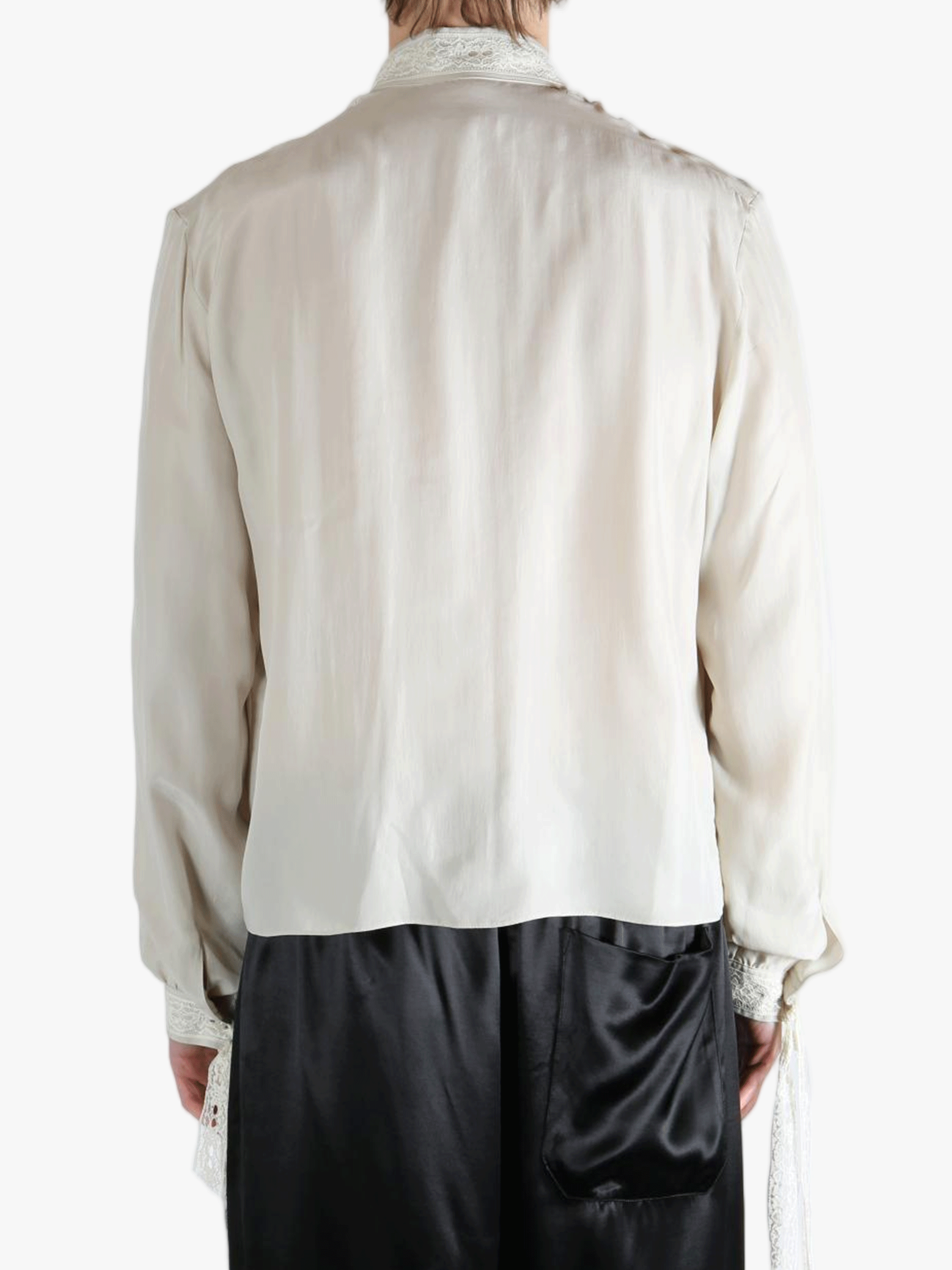White shirt worn by a person, showing the shirt's fit
