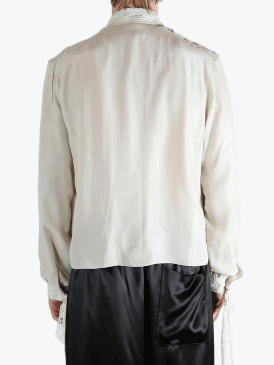 White shirt worn by a person, showing the shirt's fit