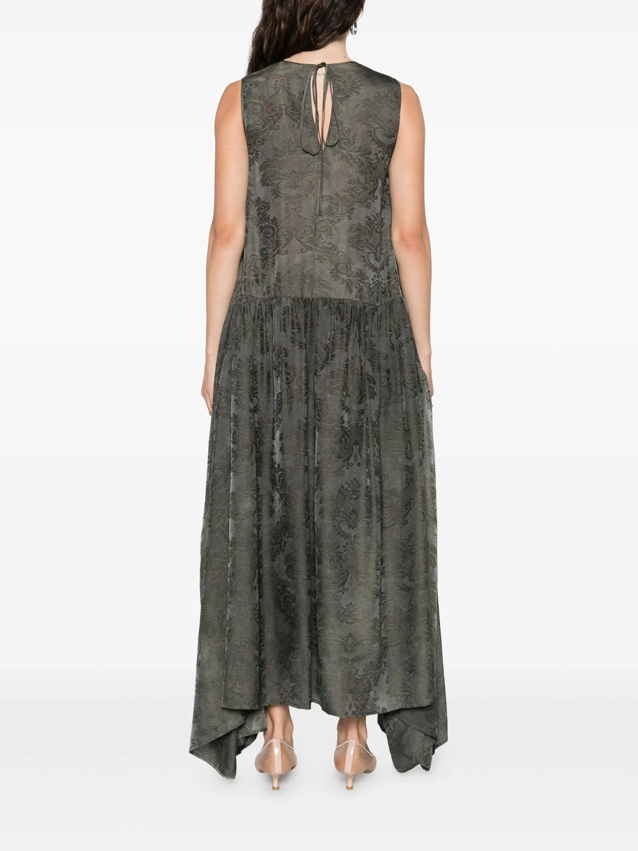 Green dress  worn by a person, showing the dress's fit