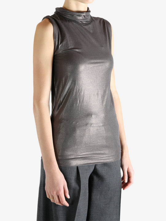 Grey tops worn by a person, showing the tops fit