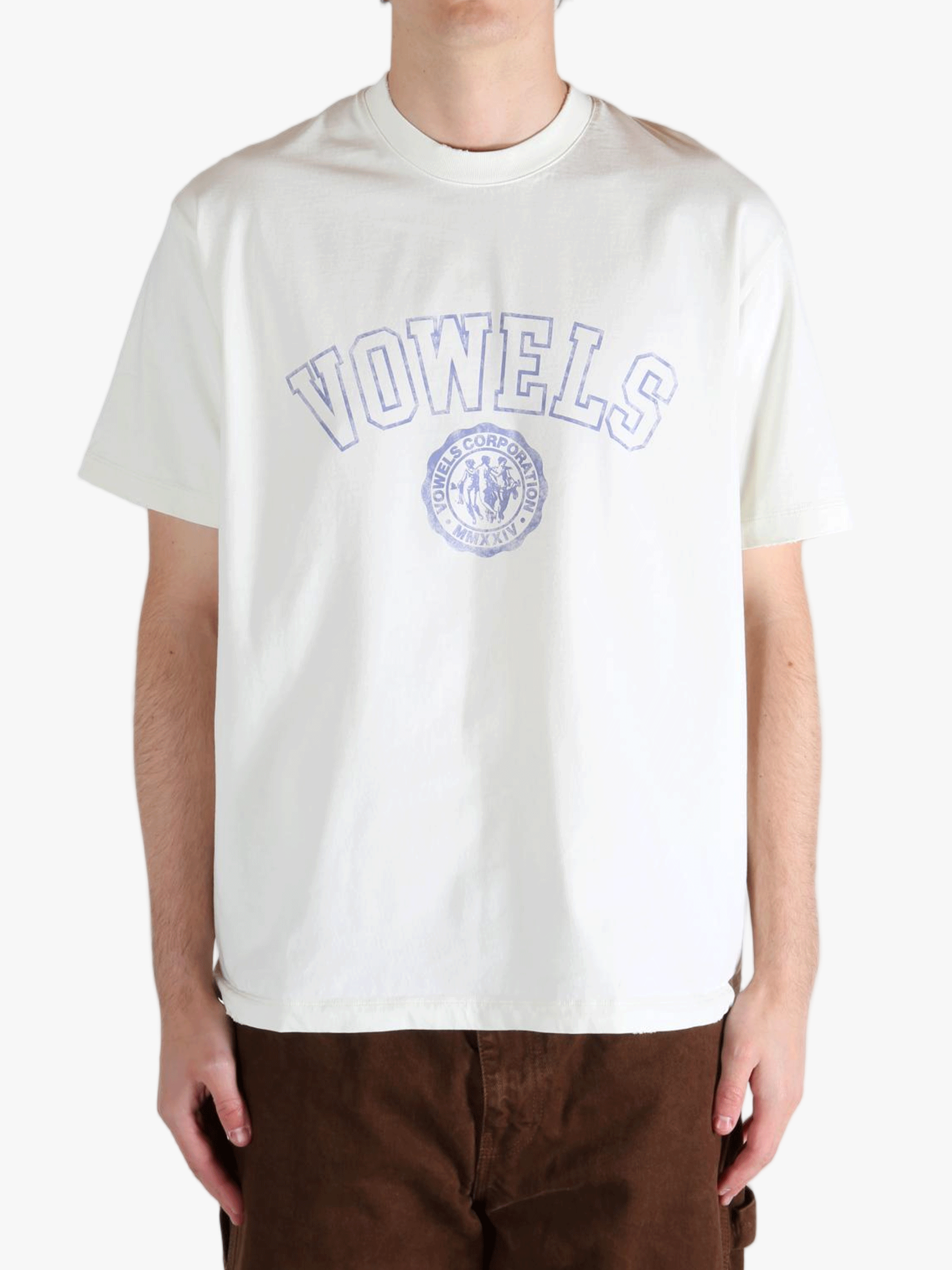 White t-shirt worn by a person, showing the t-shirt's fit