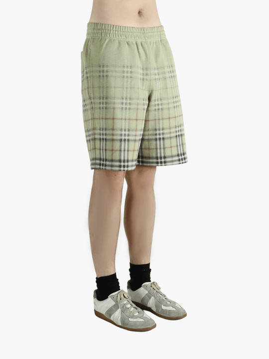 Green shorts worn by a person, showing the shorts fit