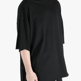 Black t-shirts worn by a person, showing the t-shirts fit