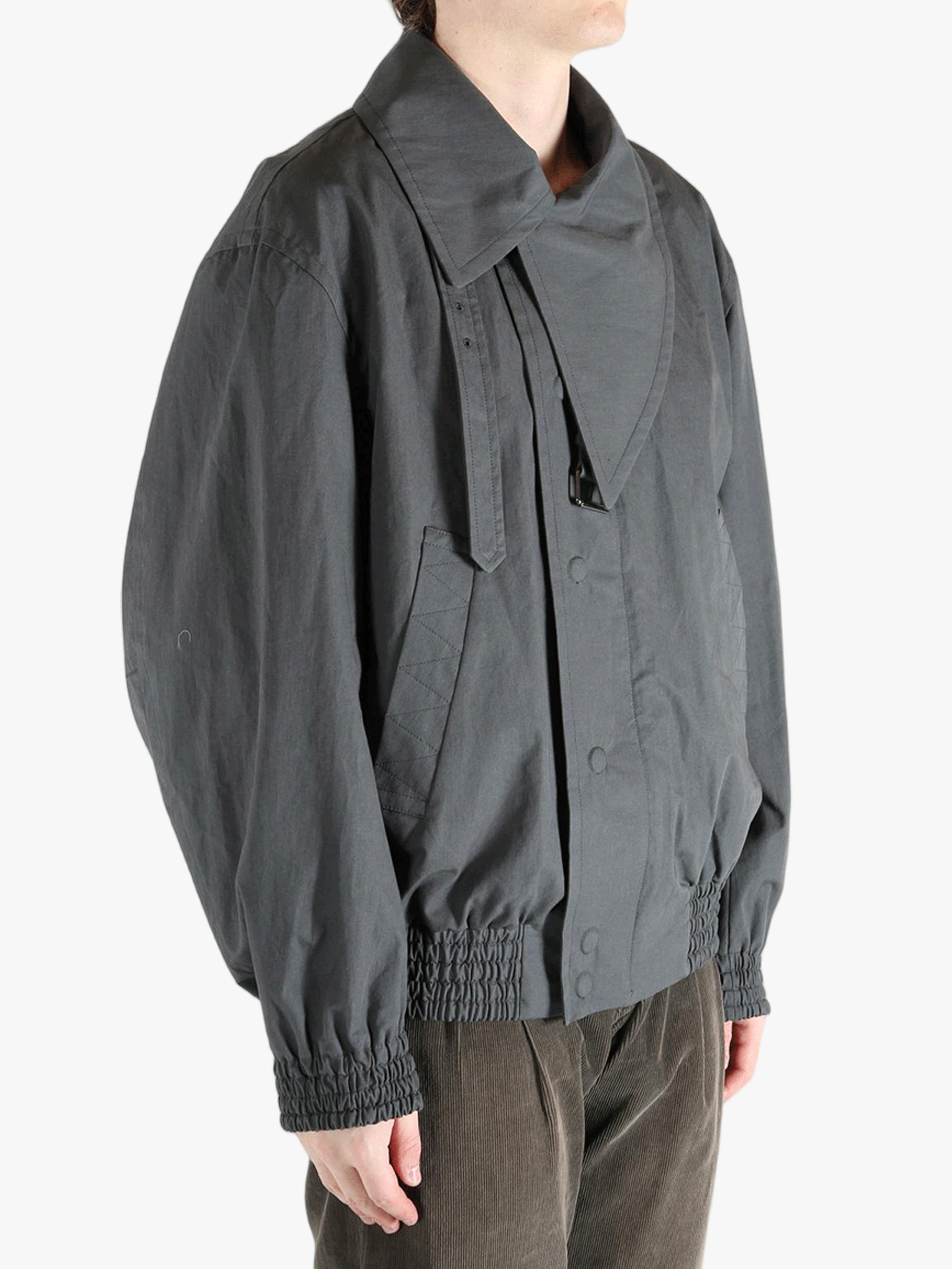 Grey jacket worn by a person, showing the jacket's fit