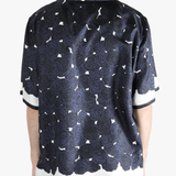 Blue shirt worn by a person, showing the shirt's fit