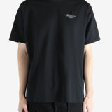 Black t-shirt worn by a person, showing the shirt's fit